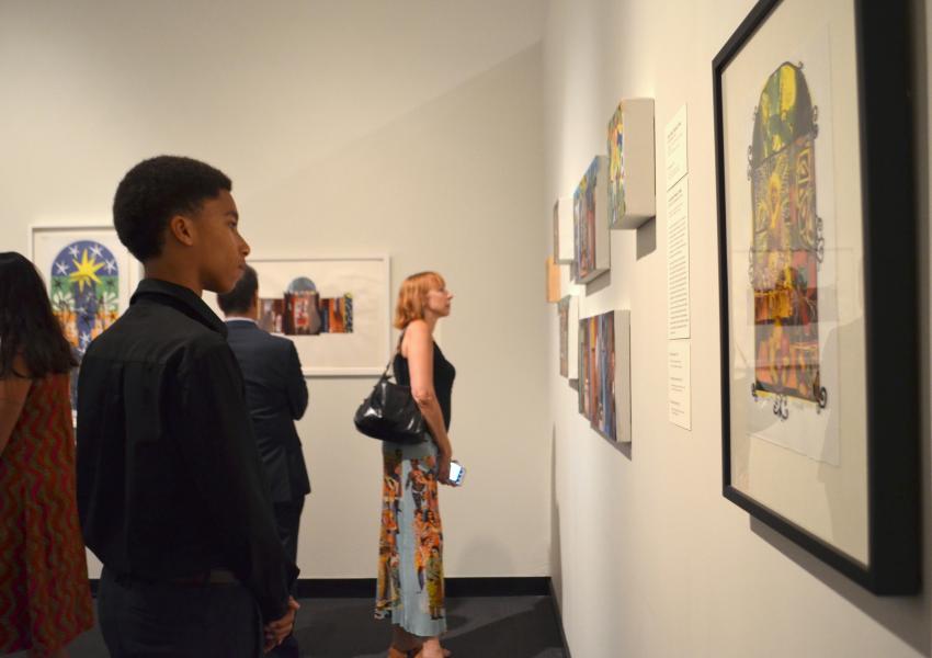 visitors looking at art in the galleries