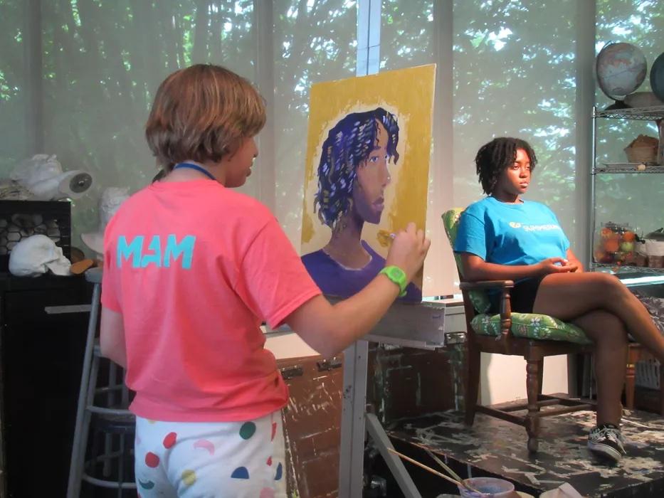 Camper painting a live portrait as part of SummerART Oil and Acrylic Easel Painting