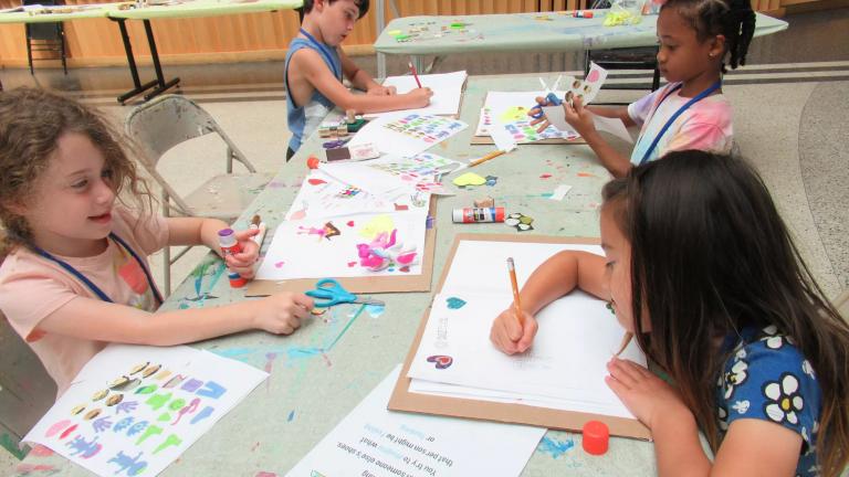 Children drawing as they partake in SummerART