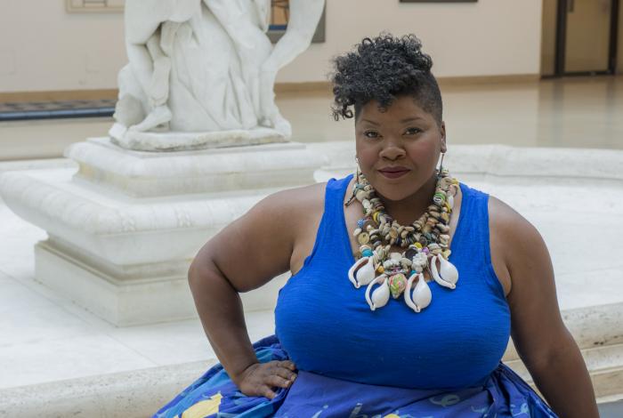 Vanessa German in a gorgeous blue tank dress with full skirt and gold necklace in Avery Court, Wadsworth Atheneum Museum of Art, Hartford, CT, 2016. Photo by Allen Phillips / Wadsworth Atheneum.