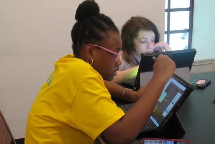 Campers in MAM's Media Lad working on Surface Pros in SummerART Digital Animation Camp